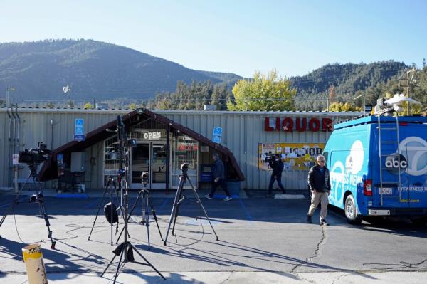 Media gather outside the Midway Market & Liquor store