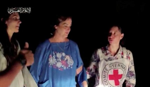 Judith Raanan and her 17-year-old daughter, Natalie with a Red Cross worker. 