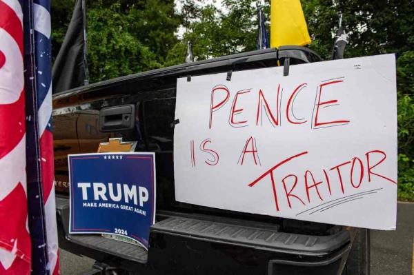 Supporters of former US president Do<em></em>nald Trump demo<em></em>nstrate outside a town hall wher<em></em>e Presidential hopeful and former Vice President Mike Pence holds a campaign event.