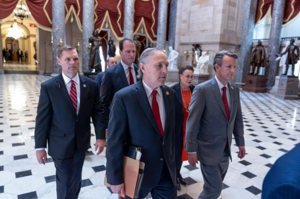 House impeachment managers, from left to right, Rep. Michael Guest, R-Miss., Rep. August Pfluger, R-Texas, Rep. Andy Biggs, R-Ariz., Rep. Harriet Hageman, R-Wyo., and Rep. Ben Cline, R-Va., walk to the Senate as they deliver the articles of impeachment against Homeland Security Secretary Alejandro Mayorkas, at the Capitol in Washington, Tuesday, April 16, 2024.