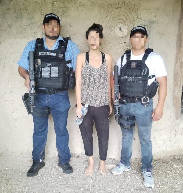 A 35-year-old US citizen, center, kidnapped in Guatemala seen after her rescue Tuesday 