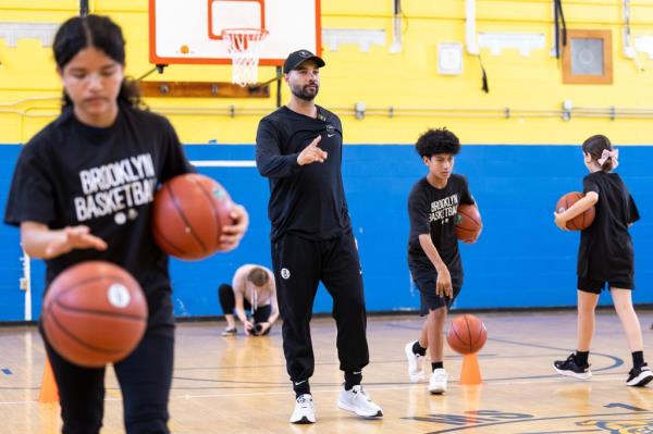 Jordi Fernandez watches a drill during a clinic held at Charles O. Dewey Middle School in Brooklyn.