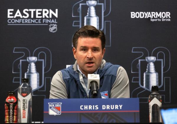 New York Rangers President, Chris Drury, speaking into a microphone during a press co<em></em>nference at the Eastern Co<em></em>nference Finals