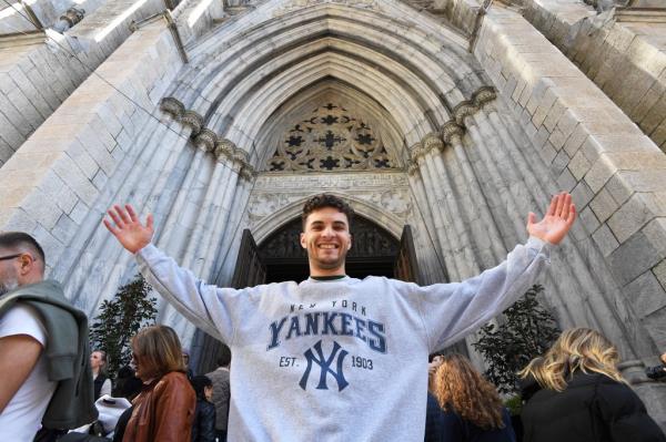 Yankees fan Declan Wholey, 20, from Rhode Island, stopped in St. Patrick's Cathedral to say a prayer for a win before heading to the Bronx to see tonight's game.