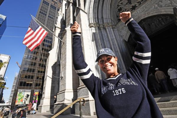 Yankees fan Patricia Lindman, 55, from Lake George, stopped in St. Patrick's Cathedral to say a prayer for a win before heading to the Bronx to see tonight's game. 