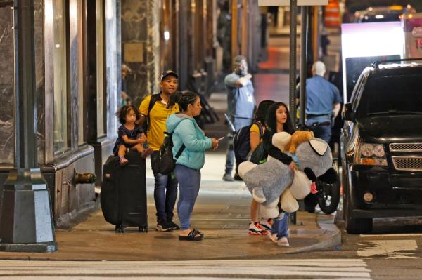 Migrants leaving the shelter at the Roosevelt Hotel in Manhattan on Aug. 27, 2024.