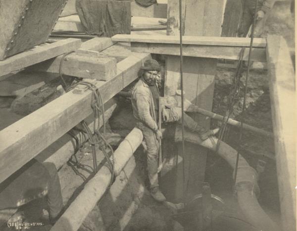 A worker at 45th Street and 8th Avenue in Manhattan circa 1901.