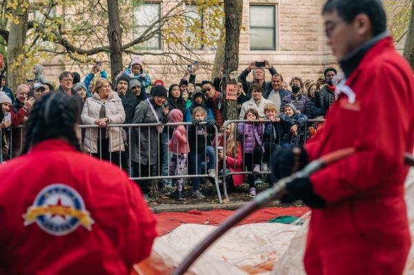 People gather outside the inflation area the day before the Macy's Thanksgiving Day Parade in New York City, U.S., November 22, 2023