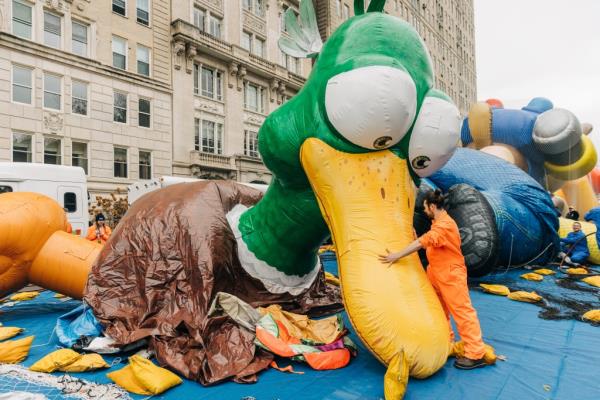 An inflation team member prepares Uncle Dan balloon the day before the Macy's Thanksgiving Day Parade in New York City, U.S., November 22, 2023