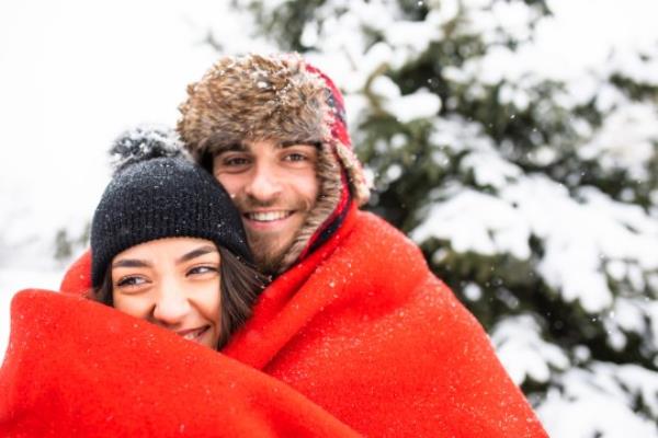 couple hugging in ablanket