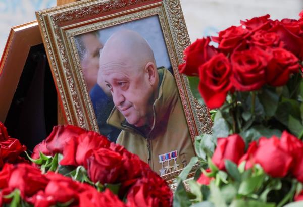 A view shows a f<em></em>ramed photo of Russian mercenary chief Yevgeny Prigozhin at his grave at the Porokhovskoye cemetery in Saint Petersburg, Russia