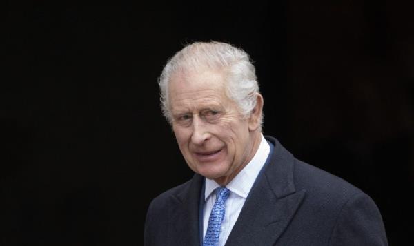 King Charles III in a suit and tie attending the Easter Mattins Service at St George's Chapel, Windsor Castle.