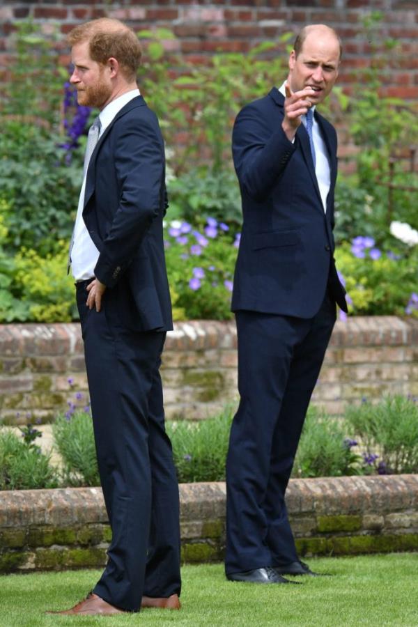 Prince William and Prince Harry unveiling a statue of their mother, Princess Diana, at The Sunken Garden in Kensington Palace.