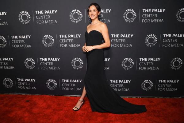 Meghan, Duchess of Sussex, smiling on the red carpet at the 2024 Paley Ho<em></em>nors Gala in Beverly Hills, dressed in a black gown