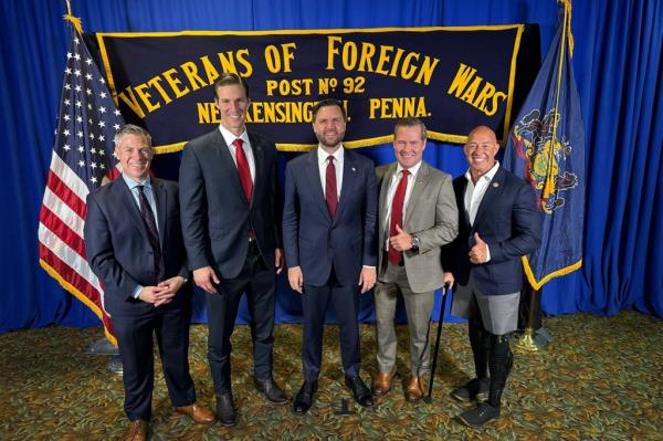 A group of veterans, including Jim Banks, Michael Waltz, and Brian Mast, standing together in suits supporting JD Vance and President Trump