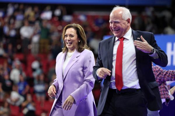 US Vice President Kamala Harris and Minnesota Governor Tim Walz gesturing during a campaign rally at the University of Nevada in Las Vegas, Nevada.