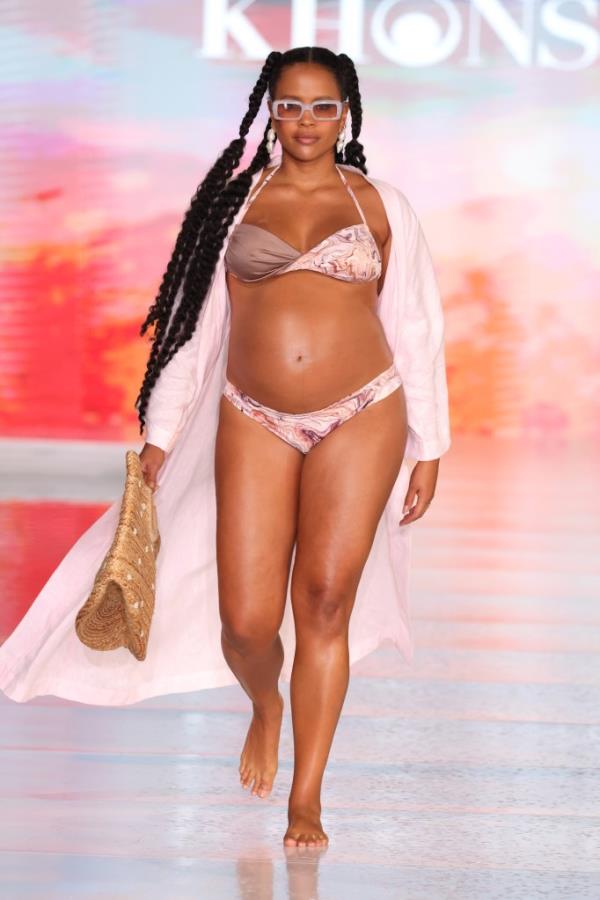 A model wearing Kho<em></em>nsu Swim attire walking down the runway at Miami Swim Week in South Beach, June 2024