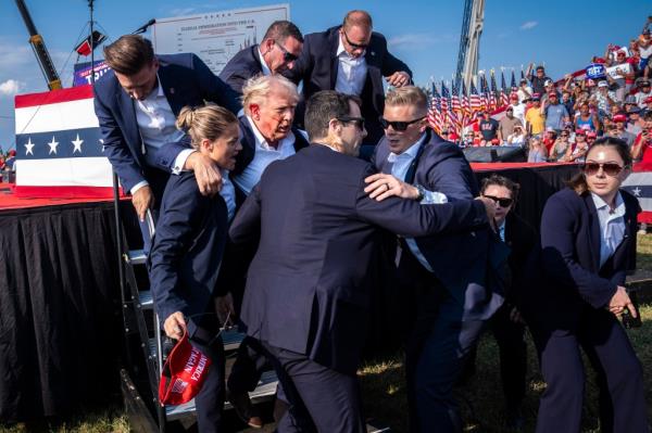 Secret Service agents remove Republican presidential candidate former president Do<em></em>nald Trump from the stage with blood on his face during a campaign rally at Butler Farm Show Inc. in Butler, PA on Saturday, July 13, 2024. 