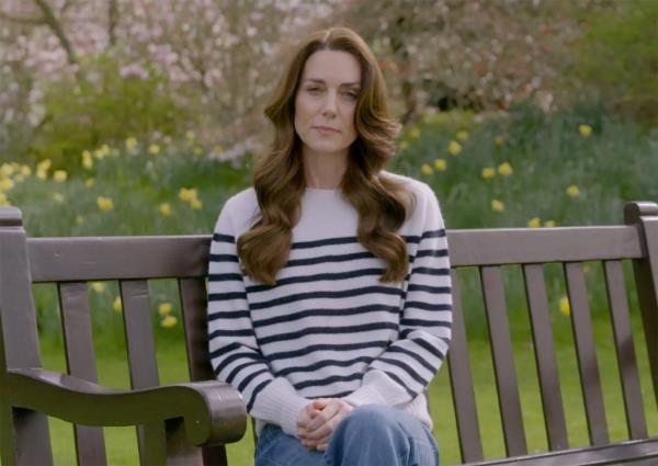 Kate Middleton, the Princess of Wales, sitting on a bench