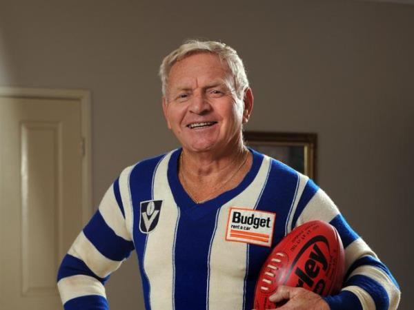 Barry Cable has been elevated to legend status in the AFL Hall Of Fame. Here at home he proudly dons one of his old North Melbourne jumpers.