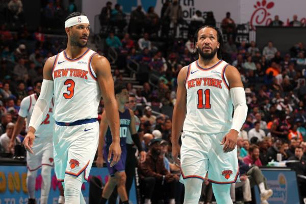 Josh Hart and Jalen Brunson look on against the Charlotte Hornets during the Emirates NBA Cup game on November 29, 2024.