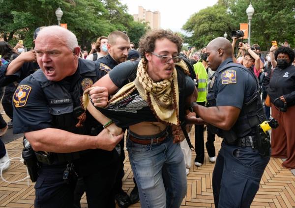 vUniversity of Texas police officers arrest a man at a pro-Palestinian protest on campus, Wednesday April 24, 2024, in Austin, Texas.