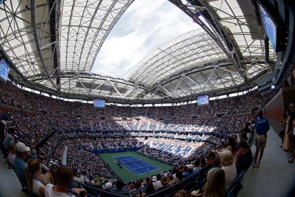 Arthur Ashe Stadium with the roof partially closed.