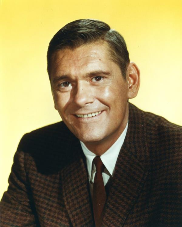 Dick York, US actor known for role as Darrin Stephens in 'Bewitched', smiling against a yellow background, circa 1967.