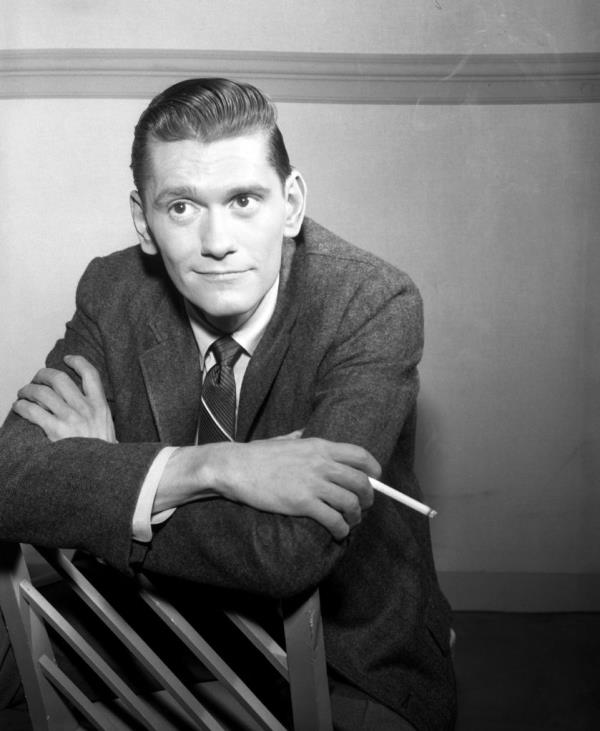 Dick York as Sandy Newell in The Millionaire, standing with crossed arms in a suit and tie, photo taken January 11, 1960.