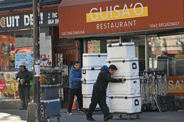 Good coolers wheeled away outside Guisa'o Restaurant. 