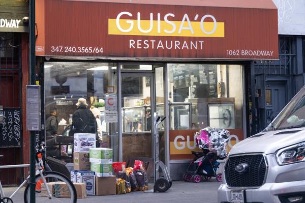 Food delivery stacked up outside Guisa'o Restaurant in Brooklyn. 