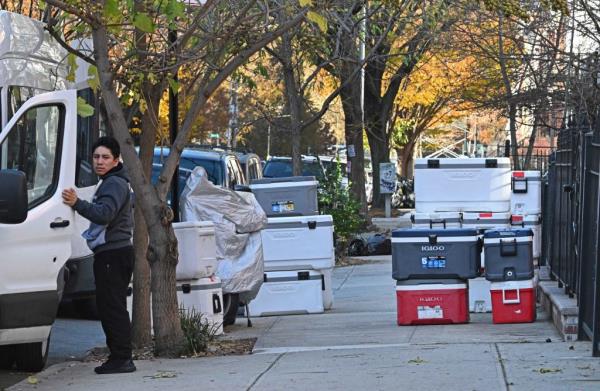 Migrant driver waits to transport coolers cooked at Guisa'o.