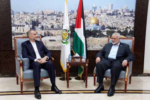  Iran's Foreign Minister Hossein Amirabdollahian, left, meets with Ismail Haniyeh, one of the Palestinian militant group Hamas leaders in Doha, Qatar, Saturday, Oct. 14, 2023. 