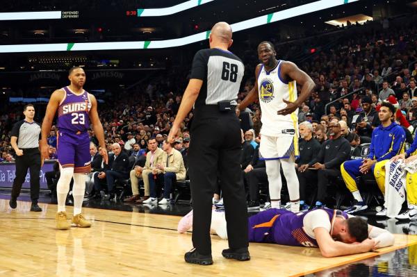 Draymond Green reacts after hitting Jusuf Nurkic.