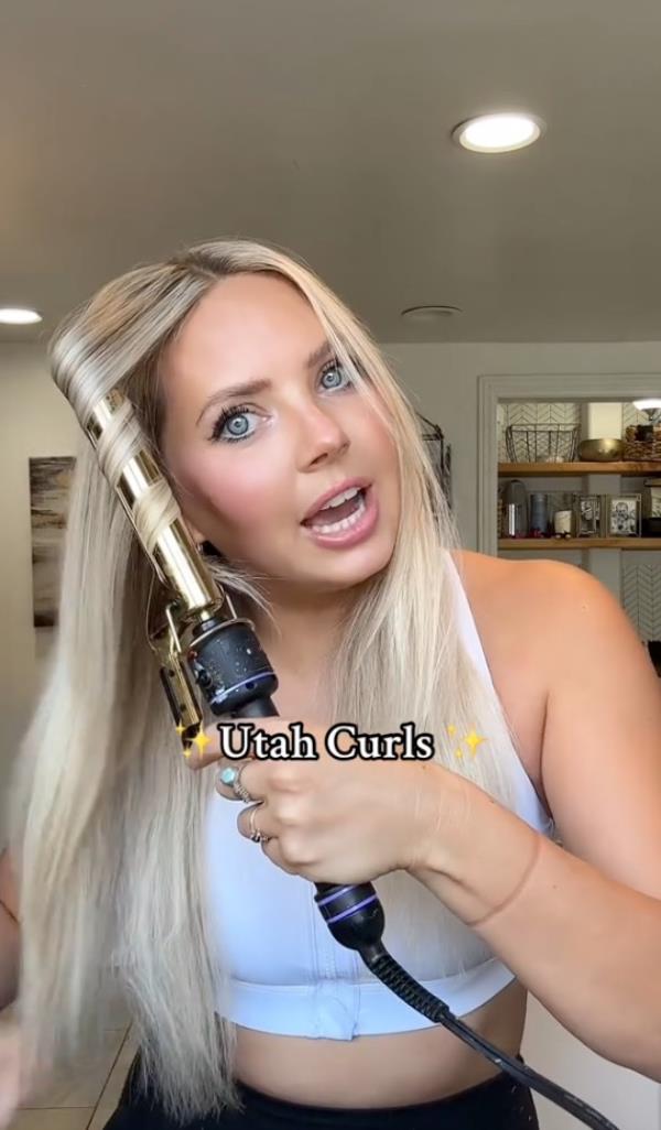 A woman named Lily Morley demo<em></em>nstrating how to create Utah curls on TikTok