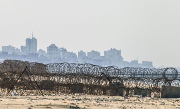 A picture taken from the beach in the southern Israeli kibbutz of Zikim shows the skyline of Gaza City on November 20, 2015