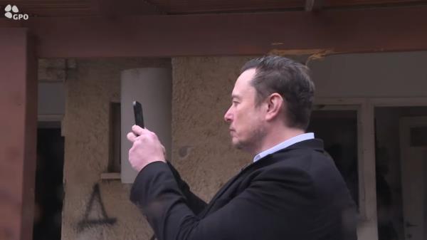 Musk was seen photographing the destruction.