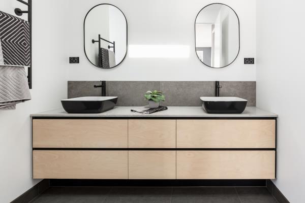 bathroom with black tile floor and accents