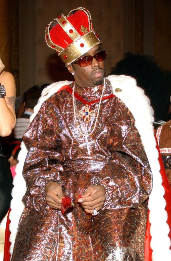 Sean Combs wearing a fur-trimmed cape and crown