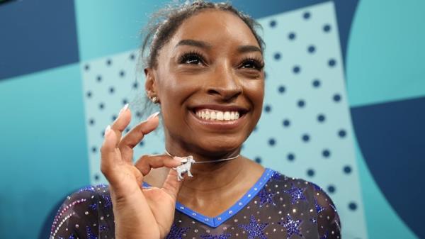 Simone Biles with her goat necklace after winning her sixth Olympic gold medal