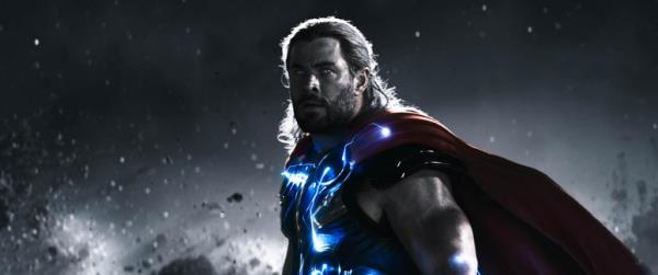 Chris Hemsworth as Thor with blue armor and a cape and big ripped muscles