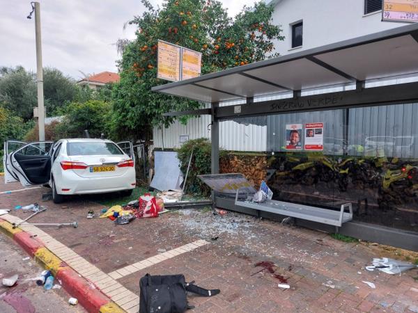 The scene of a damaged car at a bus station following a suspected ramming attack in Raanana, Israel, January 15, 2024.