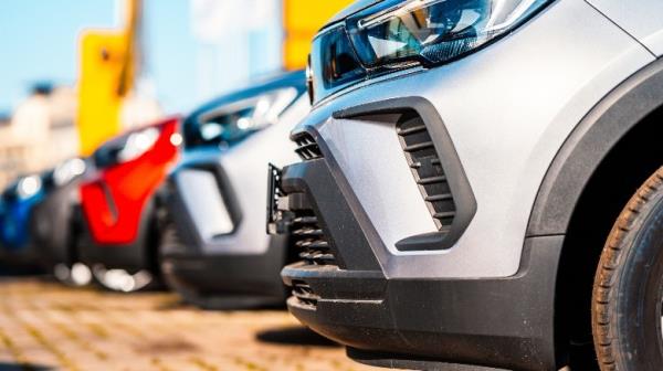 A row of cars of the same model in different colors