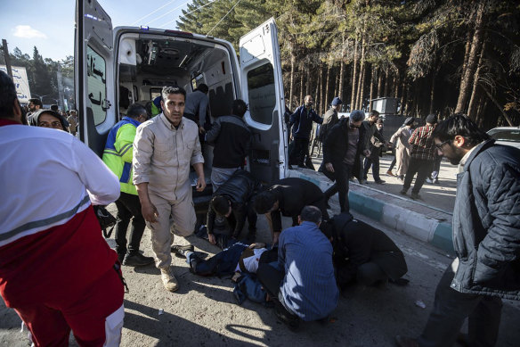 People taking care of the injured after an explosion in Kerman, Iran.