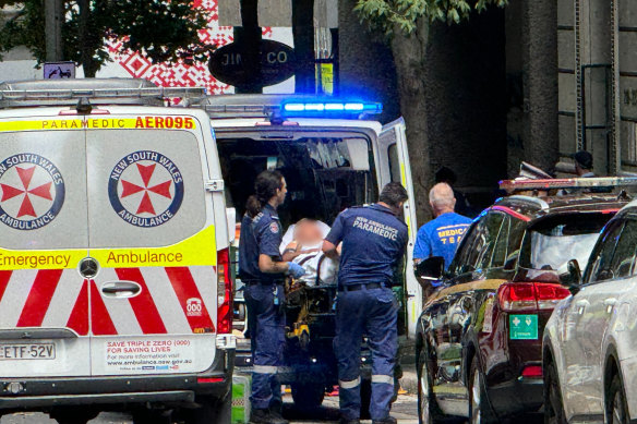 Paramedics treat Van Coo<em></em>ney on Castlereagh Street in Sydney’s CBD on Wednesday.